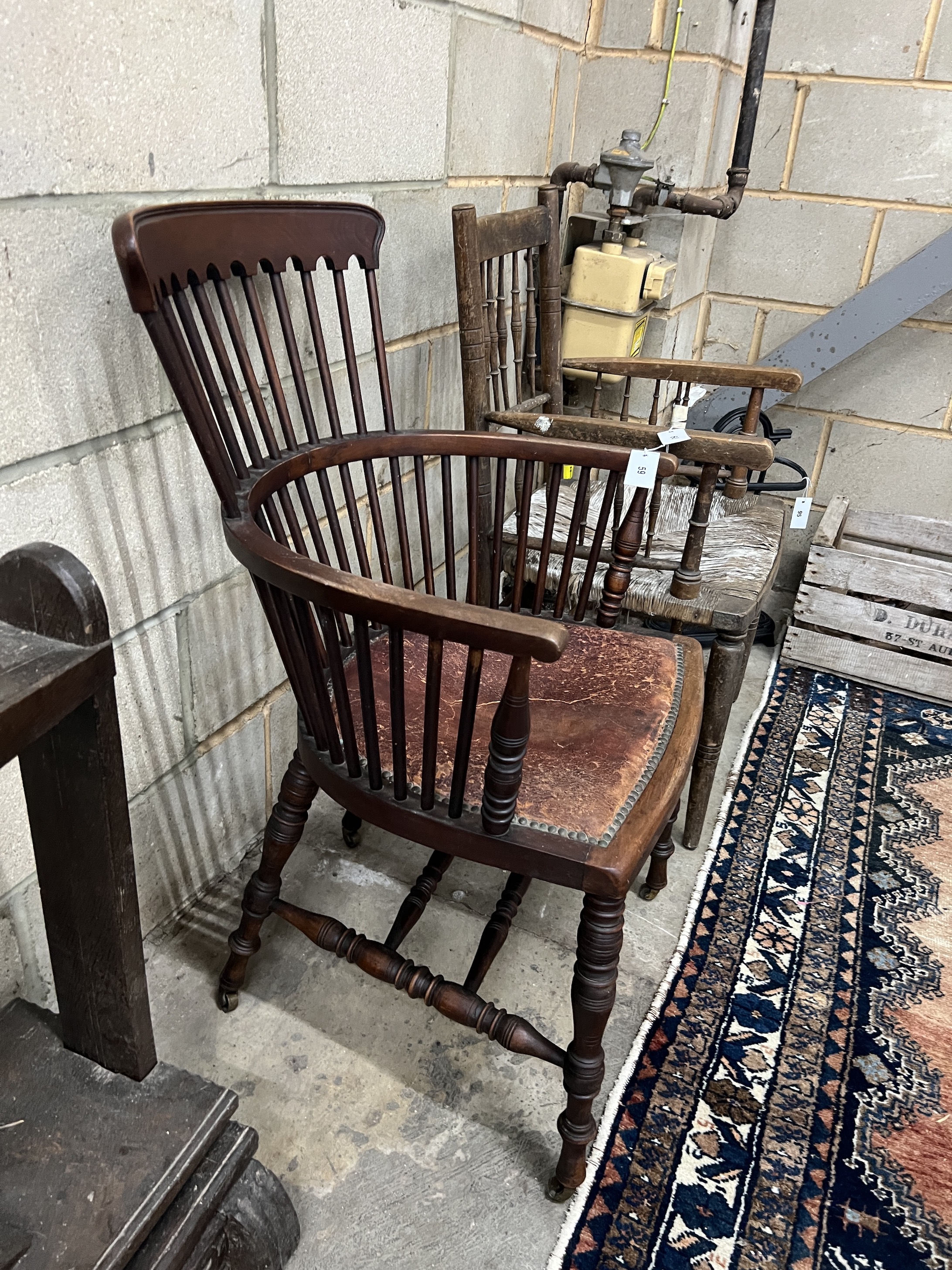 In the Manner of James Peddle for E.W. Godwin - A late 19th century mahogany comb back Windsor armchair, width 57cm, depth 46cm, height 92cm